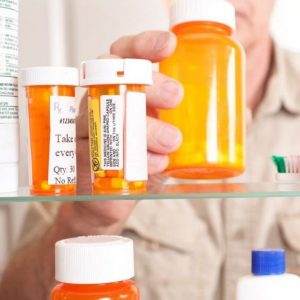 prescription-medication-bottles-in-a-medicine-cabinet